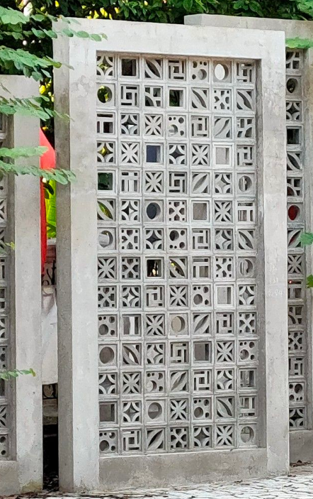 Concrete boundary wall panel filled with mixed breeze block designs