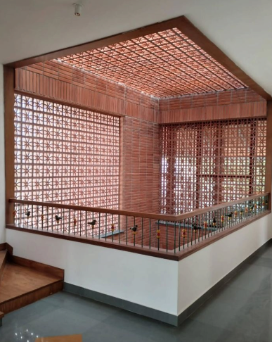 Interior courtyard with terracotta breeze block walls and ceiling screen